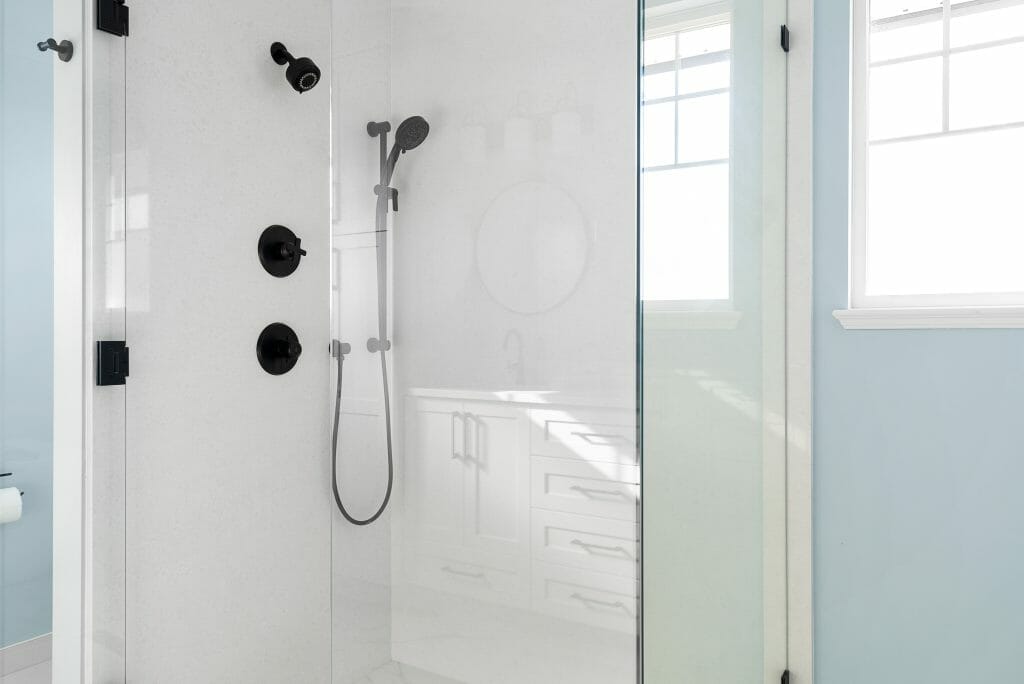 Modern shower fixtures installed during a bathroom renovation.