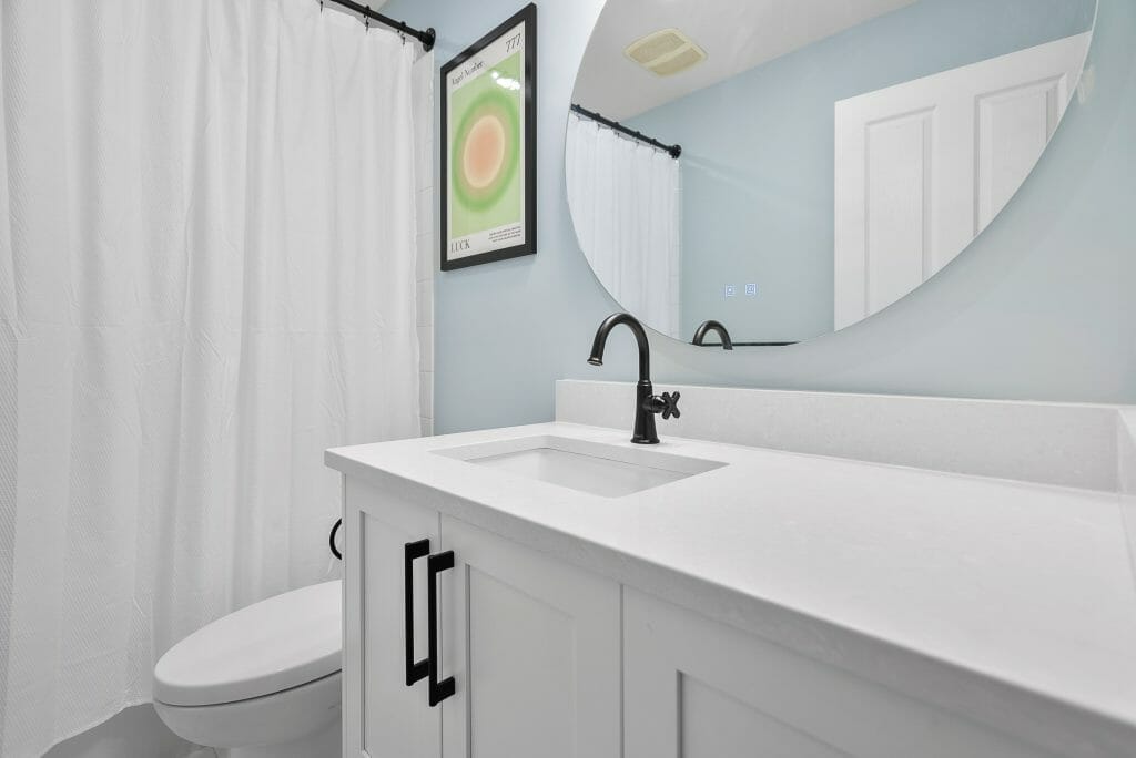 A bathroom renovation finished in white.