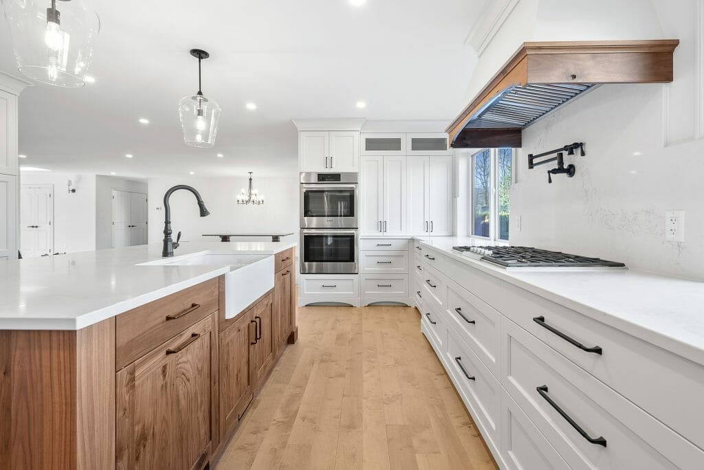 White newly renovated and updated kitchen with large kitchen island.