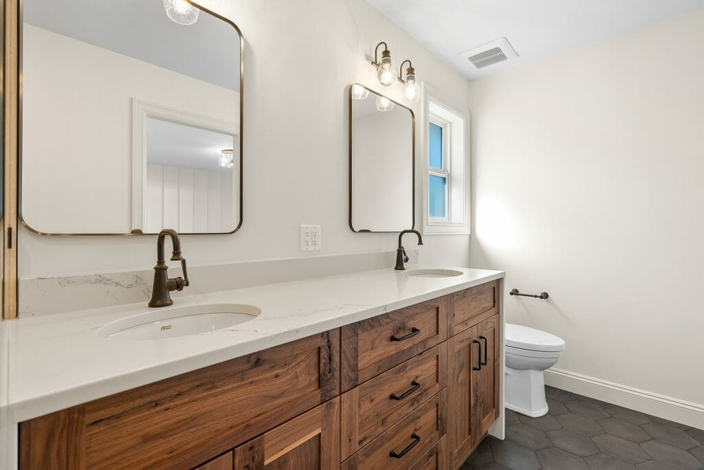 Large bathroom with his and hers sinks and mirrors