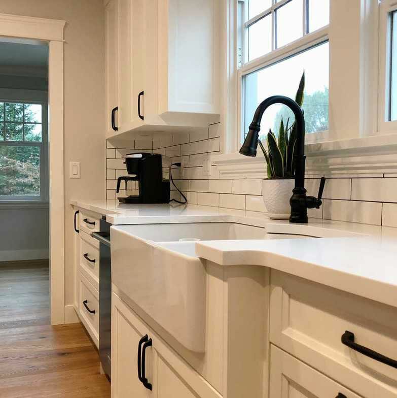 Modern kitchen renovation with large under-counter kitchen sink.