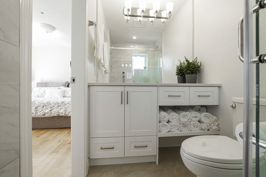 A modern refinished bathroom ensuite in white.